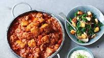 Chicken curry with saag paneer and raita Chicken curry with saag paneer and raita