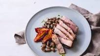 Barbecued sous vide pork chop with borlotti beans and candied tomato Barbecued sous vide pork chop with borlotti beans and candied tomato