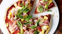 Prosciutto & pineapple pizza with fresh basil Prosciutto & pineapple pizza with fresh basil