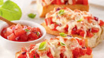 Bruschettas gratinées sur baguette Bruschettas gratinées sur baguette