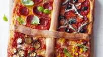 Four-in-one pizza with dough stick dividers | BBC Good Food Four-in-one pizza with dough stick dividers | BBC Good Food