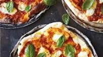 Classic Margherita pizza with buffalo Mozzarella and fresh basil Classic Margherita pizza with buffalo Mozzarella and fresh basil