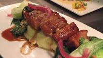 SLOW-ROASTED PORK BELLY with Sautéed Baby Bok Choy & Pine Nuts SLOW-ROASTED PORK BELLY with Sautéed Baby Bok Choy & Pine Nuts