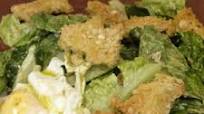 Chicken caesar salad with olive oil poached eggs and home made croutons Chicken caesar salad with olive oil poached eggs and home made croutons
