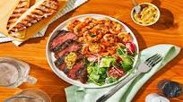 Herb-Grilled Steak & Old Bay Shrimp with Caesar Salad & Garlic Bread Herb-Grilled Steak & Old Bay Shrimp with Caesar Salad & Garlic Bread
