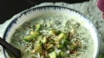 Yogurt Raita with cucumber and yellow raisins Yogurt Raita with cucumber and yellow raisins