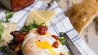 Bacon Egg and Arugula Breakfast Sandwich on Ciabatta Bread Bacon Egg and Arugula Breakfast Sandwich on Ciabatta Bread