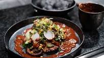 Grilled Octopus with Chipotle Chilli Sauce, Frijoles Negros, Guacamole, Corn Salsa and Tostada Grilled Octopus with Chipotle Chilli Sauce, Frijoles Negros, Guacamole, Corn Salsa and Tostada