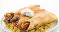 Sliced Beef Gyro Flautas with tzatziki sauce Sliced Beef Gyro Flautas with tzatziki sauce