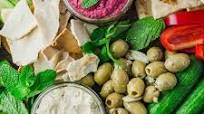 Mezze platter with baby cucumbers, beetroot spread and tzatziki Mezze platter with baby cucumbers, beetroot spread and tzatziki