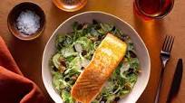 Seared salmon with Brussels sprout and dried cranberry Caesar salad Seared salmon with Brussels sprout and dried cranberry Caesar salad