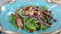 Warm shawarma salad on arugula with pomegranate vinaigrette Warm shawarma salad on arugula with pomegranate vinaigrette