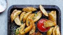 Easy spicy garlic baked potato wedges Easy spicy garlic baked potato wedges