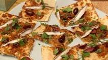 Flatbread with White Bean Hummus, Caramelized Onions, Black Olives and Spanish White Anchovies Flatbread with White Bean Hummus, Caramelized Onions, Black Olives and Spanish White Anchovies