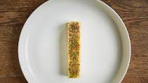 New York-style cheesecake with citrus zest and aromatics New York-style cheesecake with citrus zest and aromatics