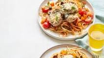 Parmesan pork with tomato & olive spaghetti Parmesan pork with tomato & olive spaghetti