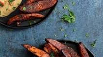 Spicy Tahini Pork Medallions with Harissa Roasted Sweet Potato Wedges Spicy Tahini Pork Medallions with Harissa Roasted Sweet Potato Wedges
