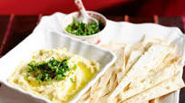 Crispy tortilla chips with hummus and chilli salsa Crispy tortilla chips with hummus and chilli salsa