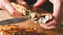 Mushroom and ricotta calzone with garlic butter Mushroom and ricotta calzone with garlic butter