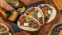 Birria-Style Pulled Beef Brisket Tacos with Corn, Smashed Guac & Herby Salsa Birria-Style Pulled Beef Brisket Tacos with Corn, Smashed Guac & Herby Salsa