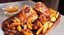 Beer-Braised Pork Knuckles With Caraway, Garlic, Apples and Potatoes Beer-Braised Pork Knuckles With Caraway, Garlic, Apples and Potatoes