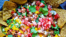 Easy cheesy beef nachos with Tostitos chips Easy cheesy beef nachos with Tostitos chips
