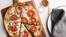 Pizza with Pesto, Fresh Tomatoes, and Mozzarella Pizza with Pesto, Fresh Tomatoes, and Mozzarella