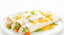 Cheddar Ranch Chicken Enchiladas with Buffalo crema and green onions Cheddar Ranch Chicken Enchiladas with Buffalo crema and green onions