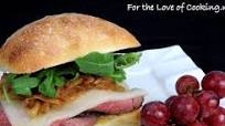 Roast Beef, Caramelized Onion, Havarti, and Arugula Sandwich on a Focaccia Roll Roast Beef, Caramelized Onion, Havarti, and Arugula Sandwich on a Focaccia Roll