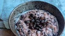 Sweet black sticky rice pudding with nutty black beans in coconut syrup Sweet black sticky rice pudding with nutty black beans in coconut syrup