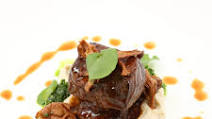 Tamarind-Braised Short Ribs with Truffle Sunchoke Purée, Watercress Purée, and Glazed Chanterelle Mushrooms Tamarind-Braised Short Ribs with Truffle Sunchoke Purée, Watercress Purée, and Glazed Chanterelle Mushrooms