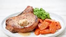 Bone-In Pork Chop with Maple Butter with roasted carrots and broccoli mash Bone-In Pork Chop with Maple Butter with roasted carrots and broccoli mash