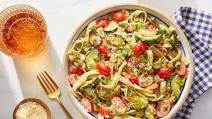 Pesto Pasta with Fresh Tomatoes & Parmesan Cheese Pesto Pasta with Fresh Tomatoes & Parmesan Cheese
