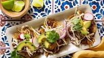 Pork carnitas tacos with cabbage slaw and avocado Pork carnitas tacos with cabbage slaw and avocado