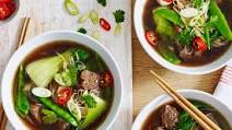 Spicy Asian beef soup with noodles and Chinese greens Spicy Asian beef soup with noodles and Chinese greens