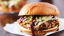 Assembling A Sandwich With Slow Smoked Pork Assembling A Sandwich With Slow Smoked Pork