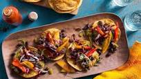 Spicy Jamaican black bean tostadas with peppers and nectarine slaw Spicy Jamaican black bean tostadas with peppers and nectarine slaw