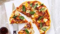 Salami, tomato, bocconcini and basil pizza Salami, tomato, bocconcini and basil pizza