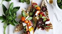Bruschetta with cherry tomatoes, basil, olives and feta Bruschetta with cherry tomatoes, basil, olives and feta