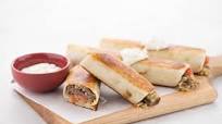 Sliced Beef Gyro Mini Chimichangas with tzatziki sauce and feta Sliced Beef Gyro Mini Chimichangas with tzatziki sauce and feta