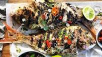 Barbecued whole fish with lemongrass and lime leaves Barbecued whole fish with lemongrass and lime leaves