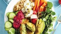 Super-green falafel bowl topped with beetroot hummus Super-green falafel bowl topped with beetroot hummus