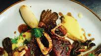Pan seared rib eye steak with crispy shallots and pork jus Pan seared rib eye steak with crispy shallots and pork jus