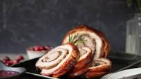 Crispy rolled pork belly with cranberries and herbs Crispy rolled pork belly with cranberries and herbs