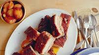 Five-hour roast pork belly with roast potatoes and salsa verde Five-hour roast pork belly with roast potatoes and salsa verde
