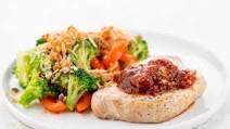 Pork Chop and Garlic Marinara Sauce with creamy garlic broccoli and red peppers Pork Chop and Garlic Marinara Sauce with creamy garlic broccoli and red peppers