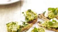 Broad bean and pea hummus with goat's cheese on bruschetta Broad bean and pea hummus with goat's cheese on bruschetta