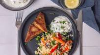 Samosas with rice salad and raita Samosas with rice salad and raita