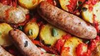 Sausage tray bake with potatoes, tinned tomatoes and herbs Sausage tray bake with potatoes, tinned tomatoes and herbs