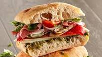 Artisan Focaccia Sandwich with Prosciutto, Pesto and Artichokes Artisan Focaccia Sandwich with Prosciutto, Pesto and Artichokes